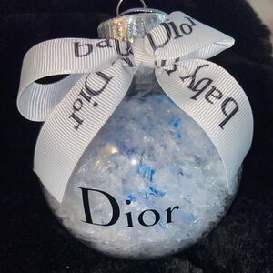 Dior Elegant White and Blue baby ornament filled with faux snow.